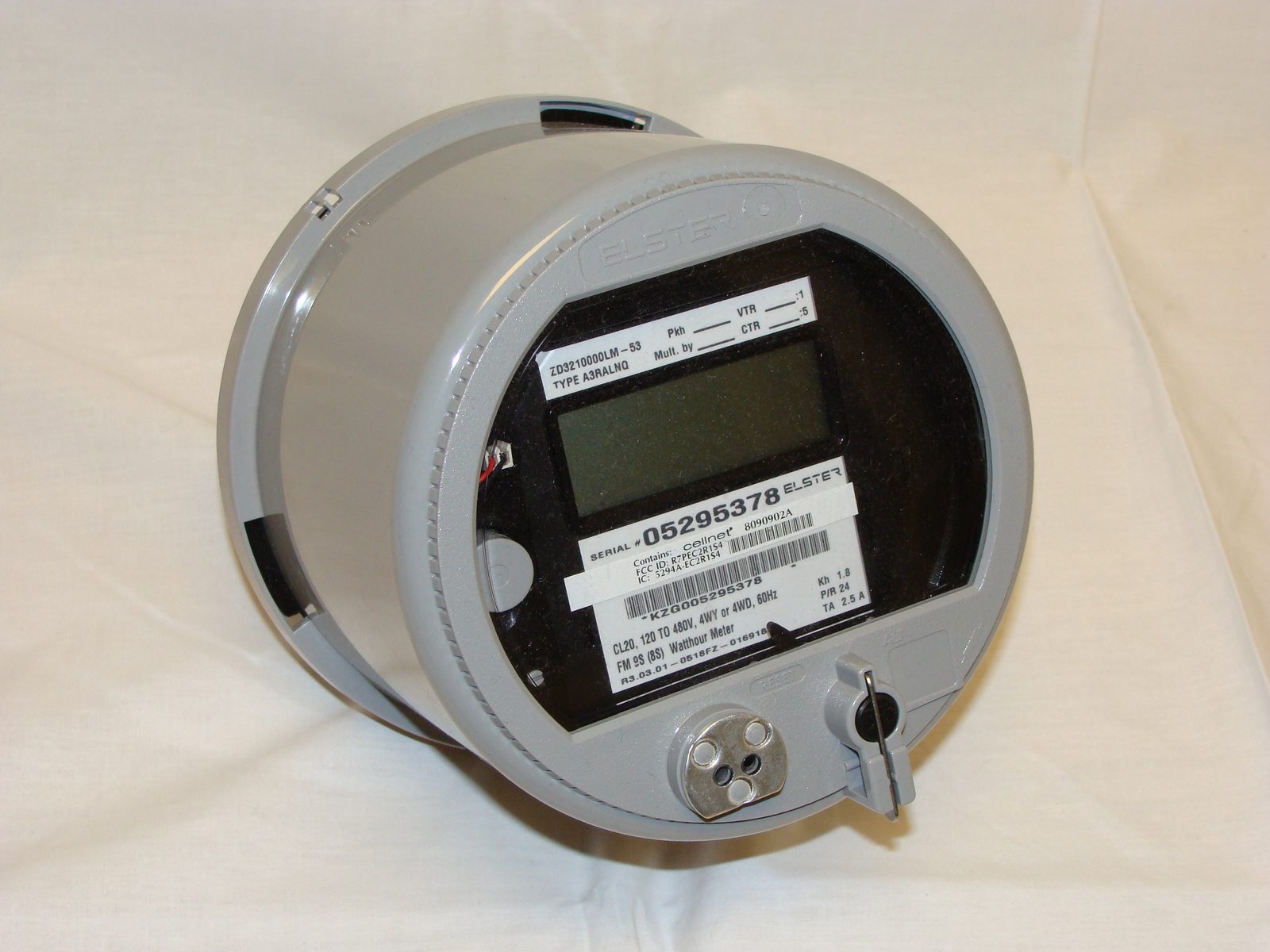 Circular electronic meter assembly in its enclosure